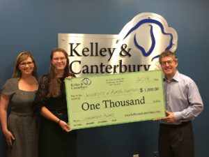 Kelley & Canterbury LLC owners presenting award to scholarship winner in Anchorage Alaska