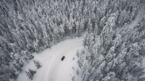 Car driving on snowy road in Anchorage Alaska