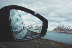 Anchorage Alaska landscape in side mirror of rental car